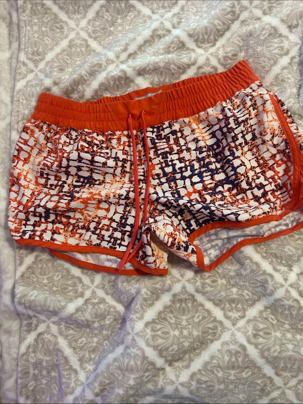 Women’s Columbia Orange Abstract Print Athletic Shorts with Elastic Waistband